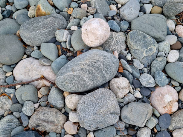 istock water-sharpened stones on the bank of a mountain river. 1472450069