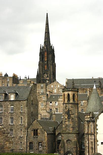 Highland Tolbooth Kirk Spire and Edinburgh Rooftops stock photo