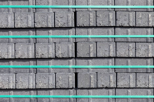 Pallets with freshly made racks of bricks at a construction site or near an industrial plant. Storage of building materials at the warehouse.