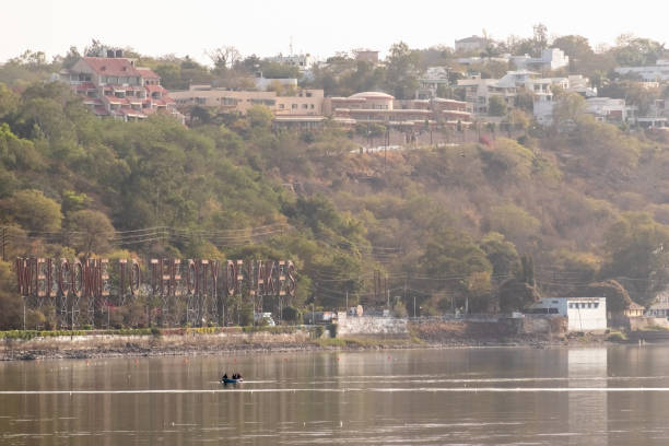 A view of the green and hilly Shamla hills area in Bhopal. Bhopal, India - March 2018: A view of the green and hilly Shamla hills area above the Upper Lake of the city of Bhopal. bhopal lake stock pictures, royalty-free photos & images