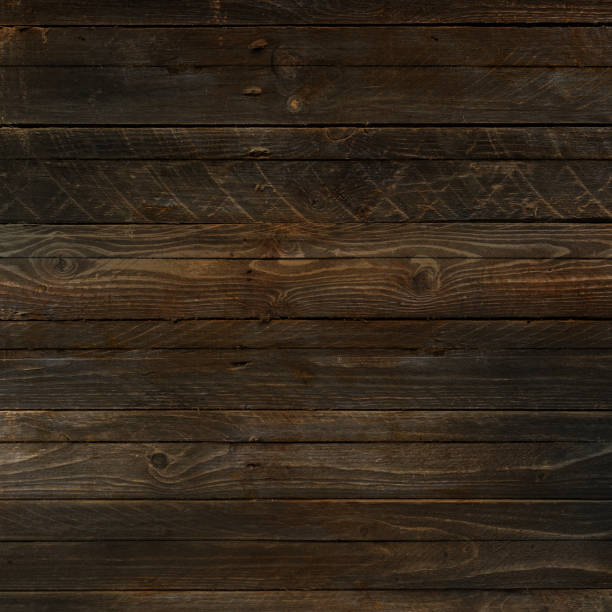 istock Dark brown wood texture background 1472454360