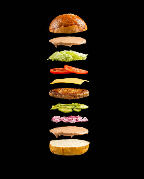 istock Floating burger ingredients on the black background 1472455142