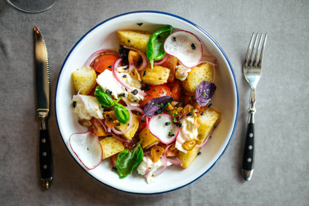 istock Gourmet organic salad with crackers and vegetables 1472455199