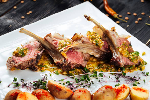istock Roatsed lamb rib cutlets with baby potatoes 1472455205