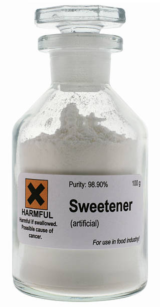istock Artificial sweetener on glass container with warning sign 147245564