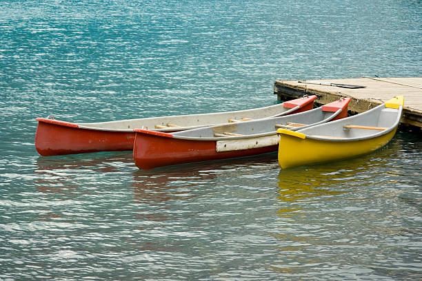 Canoes at Moraine Lake stock photo