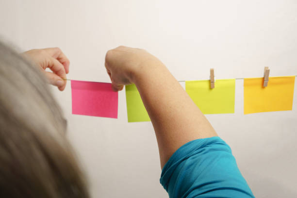 istock woman hanging postit on a clothes line 1472457193