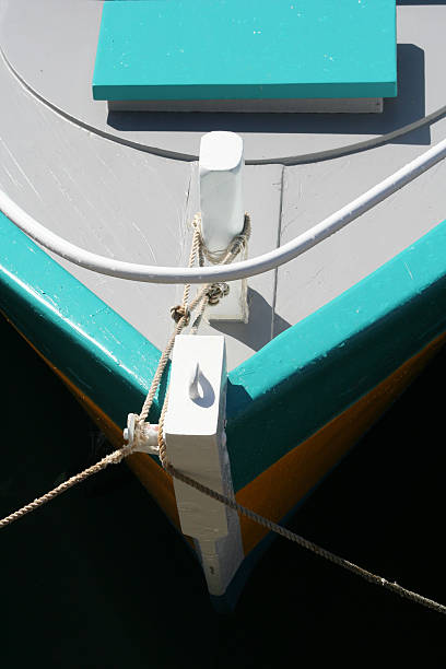 coloured docked ship in sunny harbour