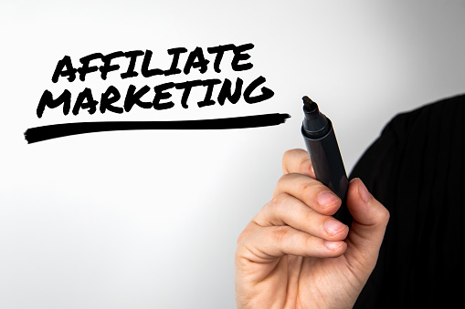 Hand writing Affiliate Marketing with marker. Business concept.