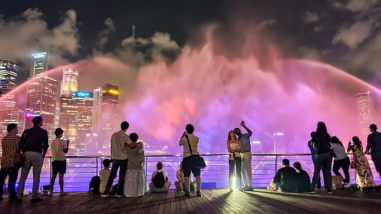 Marina Bay, Singapore - August 31, 2022 : People Watching Light Show Ar Marina Bay.
