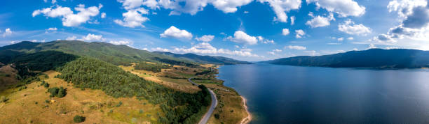 istock road near lake 1472464008