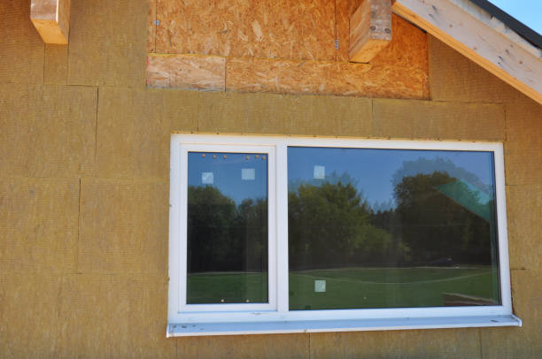 istock Attic window insulation with mineral wool outdoors 1472464544