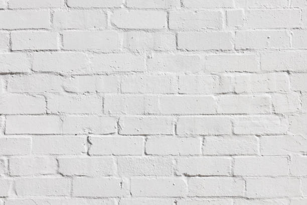 istock Section of an old, freshly painted brick wall 1472472970