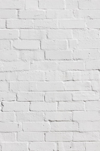 istock Section of an old, freshly painted brick wall 1472472974