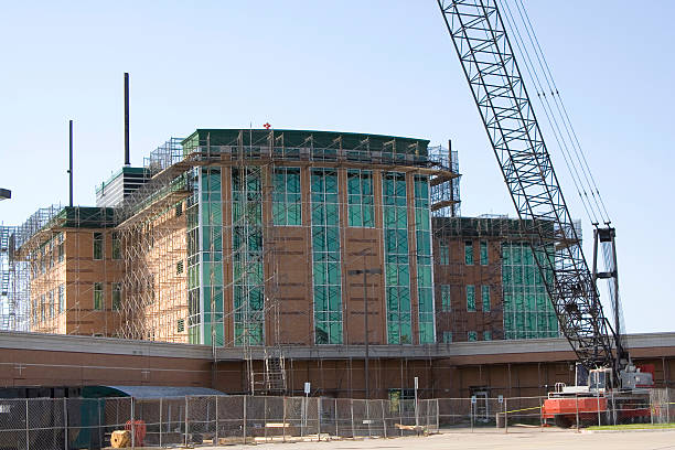 New Hospital Under Construction Outdoor shot of a new hospital under construction. new big tube stock pictures, royalty-free photos & images