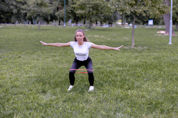 istock Athlete with outstretched arms doing leg exercises 1472473779
