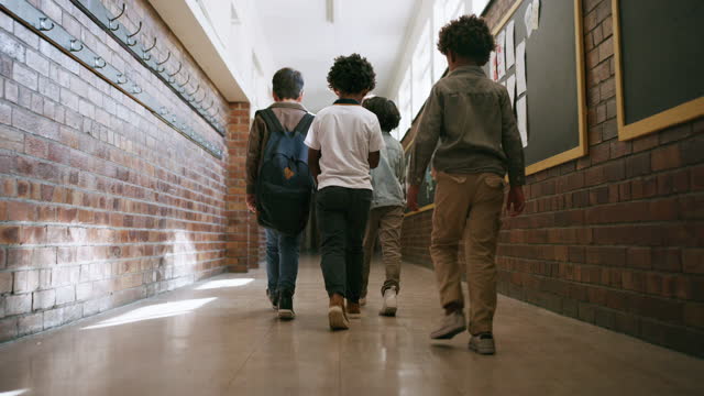 Children, students or walking in school hallway for classroom education, learning lesson or studying. Kids, group or diversity friends in corridor for community bonding, recess break or collaboration