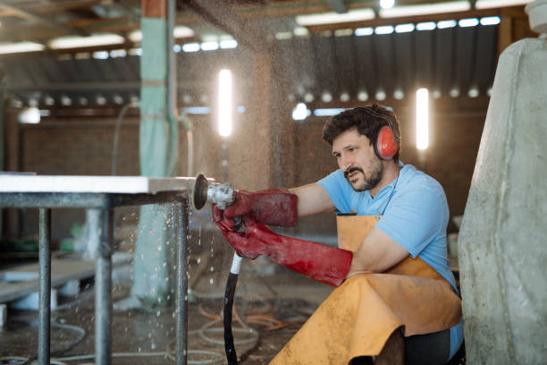 istock Craftsman using wet drill to polish terrazzo table 1472475369