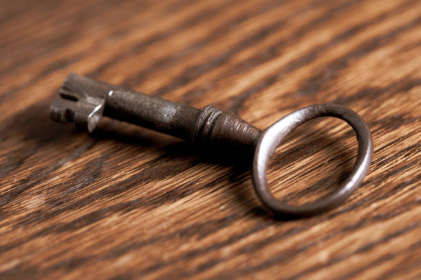 istock Antique vintage old key on wooden table 1472475640