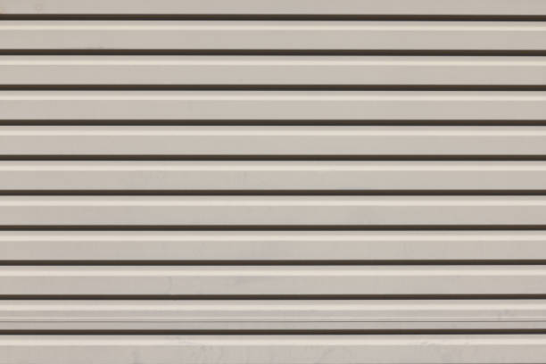 istock Section of a colored metal garage door 1472475719