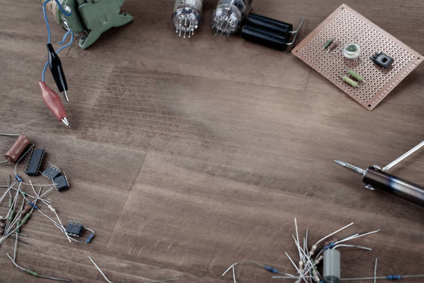 DIY - do it yourself workplace with soldering iron, tools and electronic components concept background