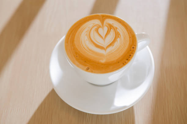 istock A wooden table with a fragrant cappuccino and baked bread 1472476768