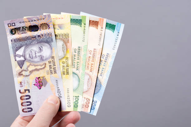 istock Malawian money on gray background 1472476835