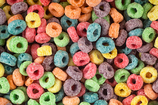 Multicolor cereal rings as food background. Colorful breakfast food.