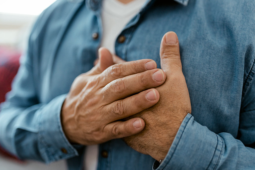 Heart attack, man with chest pain suffering at home, health problems concept