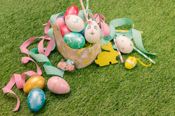 Decorated Easter Eggs in a Woven Basket with Springtime Accents