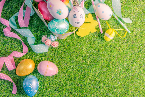istock Easter Egg Hunt: Basket Filled with Colorful Eggs on Lush Green Grass 1472482444