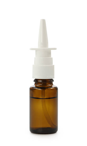 Brown nasal spray bottle filled with liquid