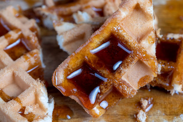 istock Soft fresh waffles with bee honey close-up 1472496275