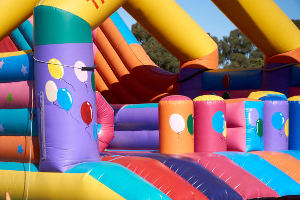 istock Part of a colourful Jumping Castle 1472497282