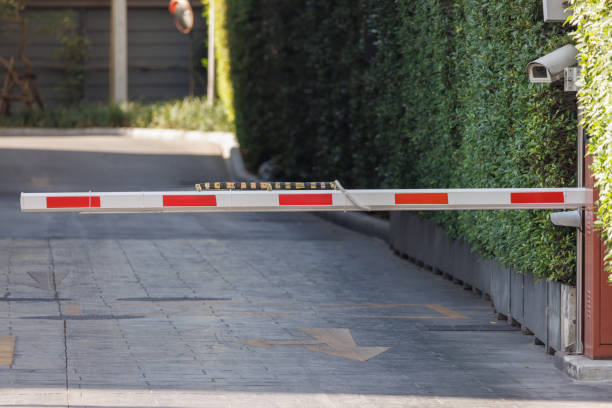 istock automatic barrier bar for home village security system with CCTV. security gate for resident. 1472499105