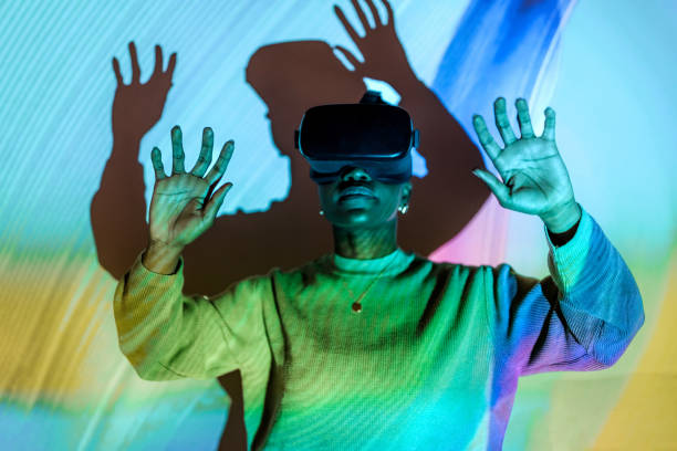 istock Young hipster woman with wearing virtual reality goggles, in touch with virtual world 1472499302