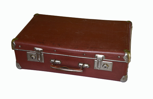 Old brown suitcase isolated on the white background