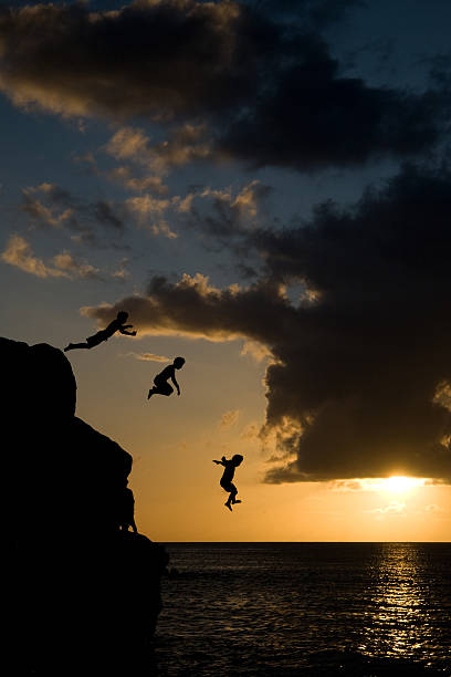 istock Jumping in Waimea Bay 147250112