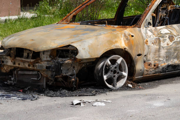 istock Burnt out car crash after fire. Close-up. 1472504571