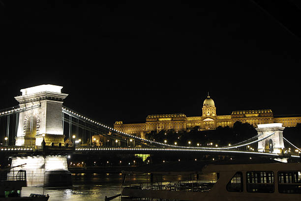 Budapest Chain Bridge at night Royal palace in the background on the Buda Hill. danube river stock pictures, royalty-free photos & images