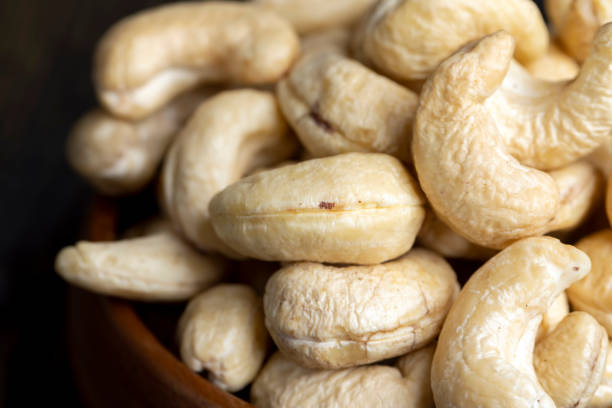 istock Hard roasted and peeled cashew nuts on the table 1472504644