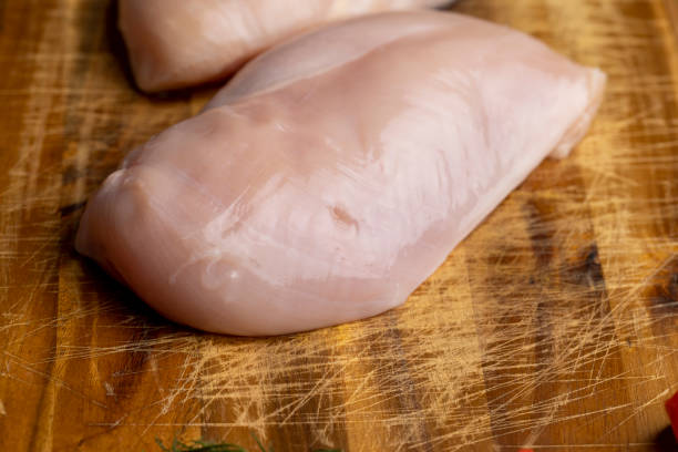 istock Freshly washed and skinned chicken meat 1472504740