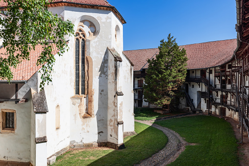 Brasov - Romania. July 16, 2022: Fortified Prejmer church of 13 century built on Romanesque basilica surrounded by defensive wall equipped with shelter-rooms for inhabitants in case of attack