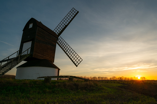 The sun sets on Pitstone Windmill in Buckinghamshire, south east England.
