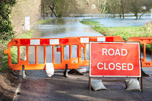 A road is closed due to floods near the village of Cookham in Berkshire, England.