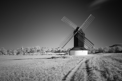Autumn sunshine falls on Pitstone windmill in the English countryside. Black & white conversion of an infrared image.