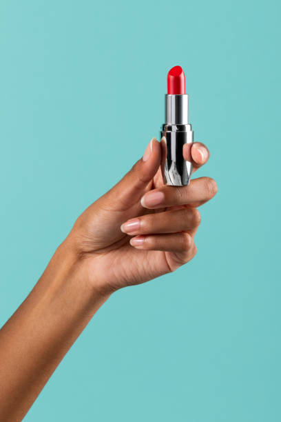 istock Crop black woman showing lipstick 1472512060