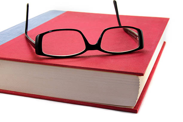istock Book with a pair of Eye Glasses 147251250