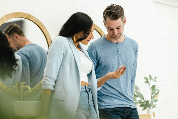 istock Biracial Couple In the Modern Washroom Getting Ready for Work 1472512524
