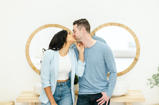 Young biracial couple getting ready for work together